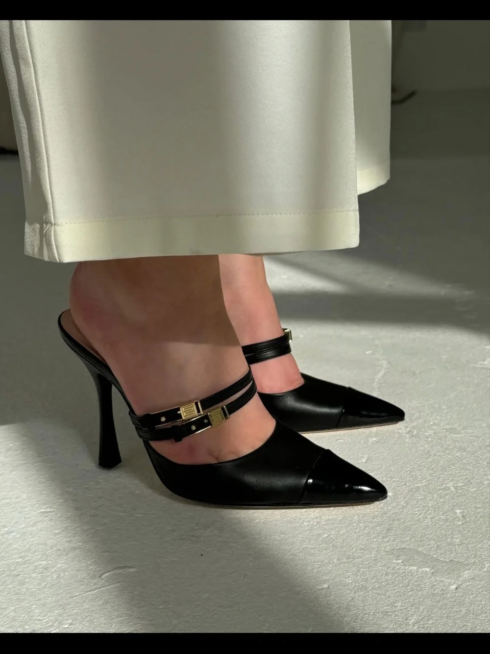 Black Pointed Leather Mule Heels with Double Strap and Gold Accent